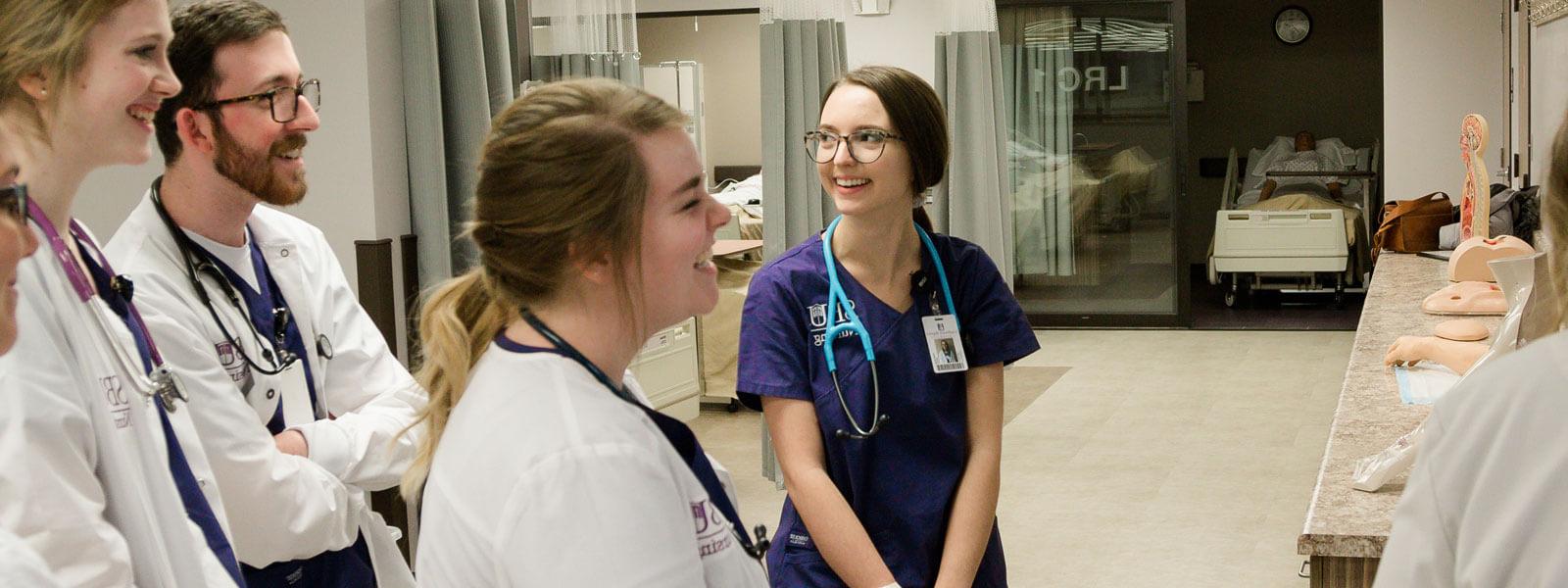 students interact in nursing training center